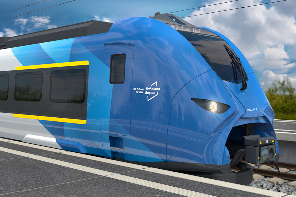 Simulation eines Zuges in Weiß und Blau am Bahnsteig.