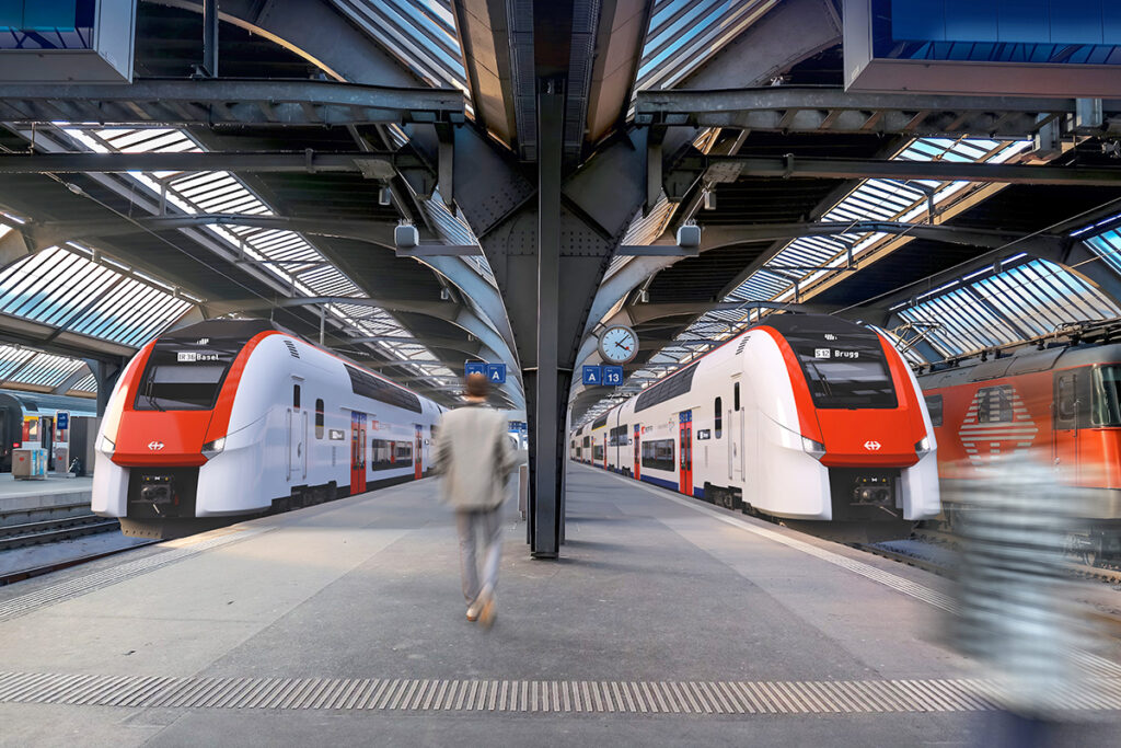 Visualisierung von zwei Doppelstockzügen in einer Bahnhofshalle.